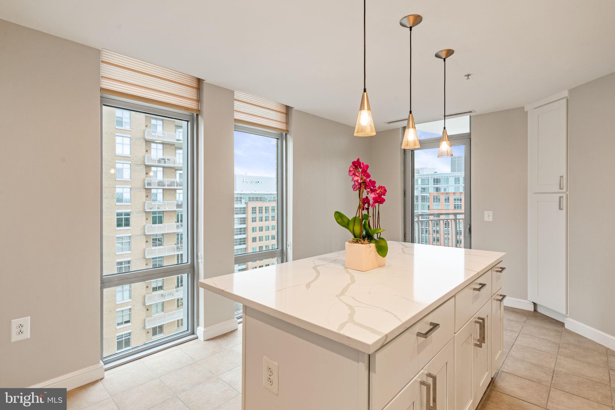 11990 Market Street, Unit 1311 Reston, VA 20190 - Photo 29 of 59 a view of kitchen island with kitchen island and a table