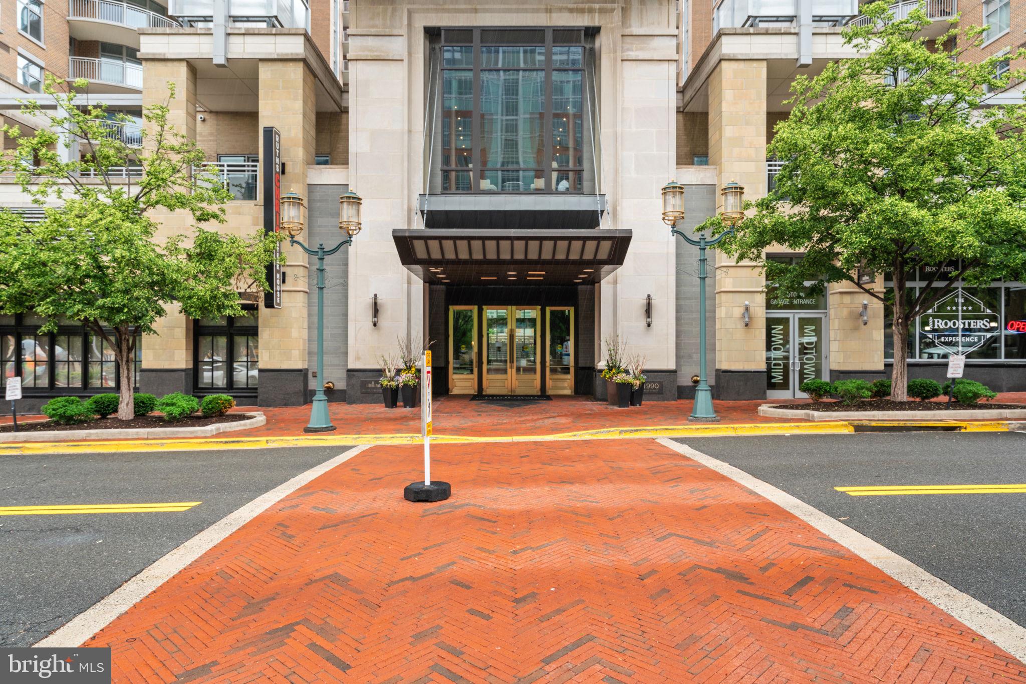 11990 Market Street, Unit 1311 Reston, VA 20190 - Photo 3 of 59 a view of a brick building with a swimming pool