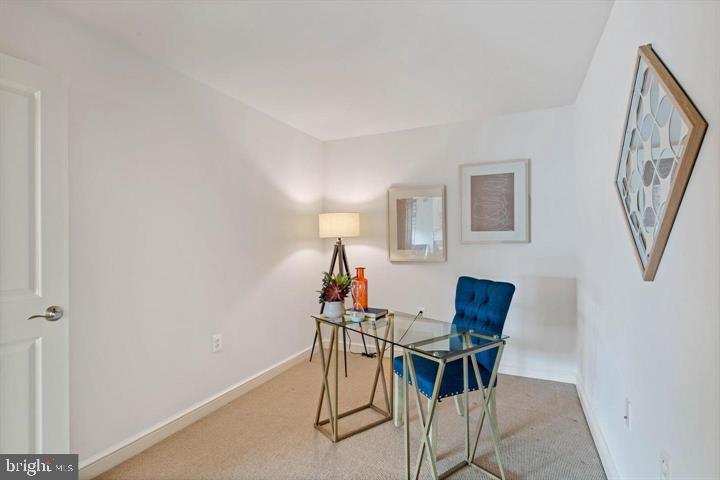11990 Market Street, Unit 1311 Reston, VA 20190 - Photo 35 of 59 a workspace room with furniture and a chandelier fan