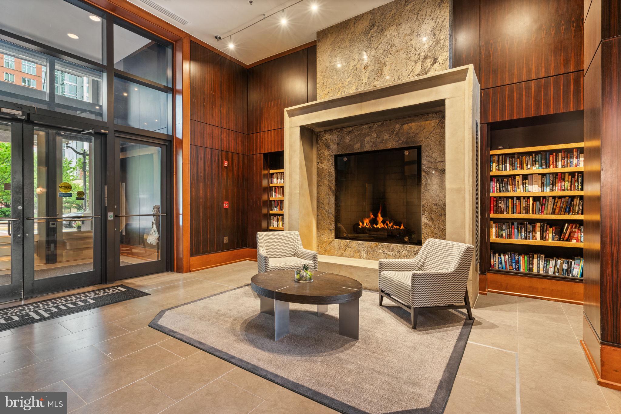11990 Market Street, Unit 1311 Reston, VA 20190 - Photo 4 of 59 a living room with furniture a rug and a large window