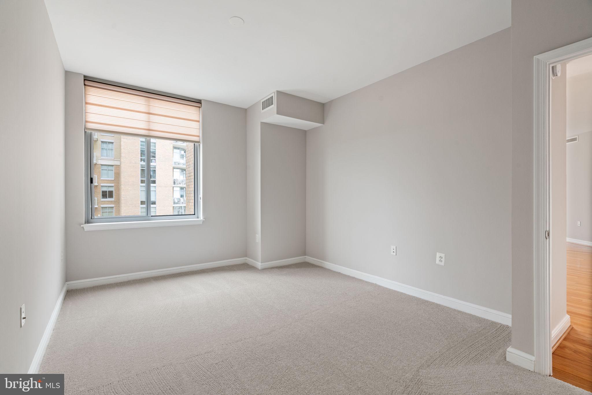 11990 Market Street, Unit 1311 Reston, VA 20190 - Photo 47 of 59 a view of an empty room with a window