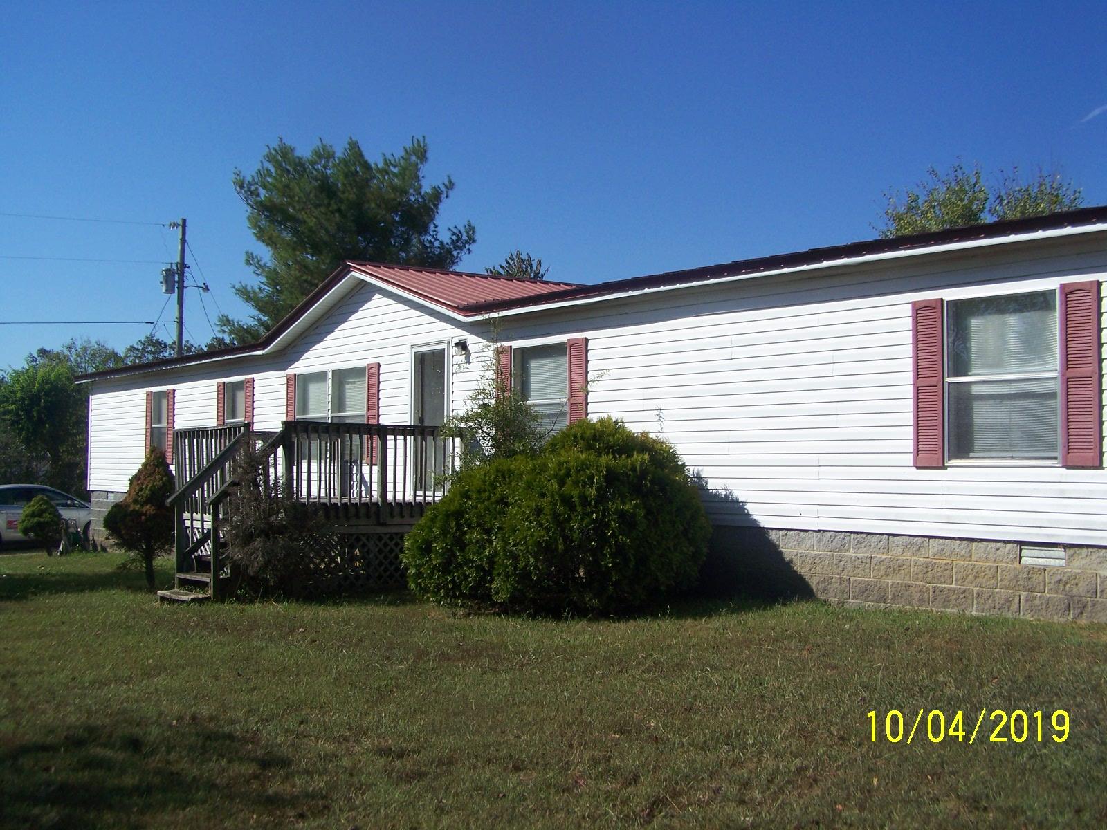 410 Cooper Road Morrison, TN 37357 - Photo 3 of 19 a front view of a house with garden
