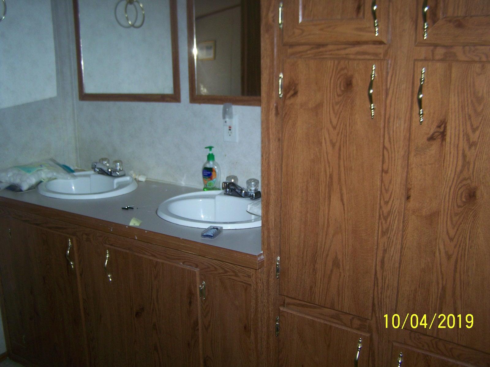 410 Cooper Road Morrison, TN 37357 - Photo 10 of 19 a bathroom with a sink vanity granite tub shower and a mirror