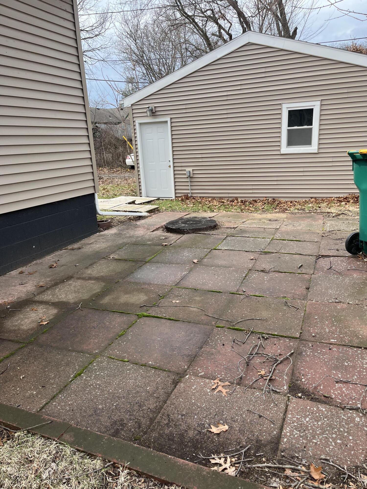308 South Howard Street Gary, IN 46403 - Photo 3 of 17 a view of a house with a patio