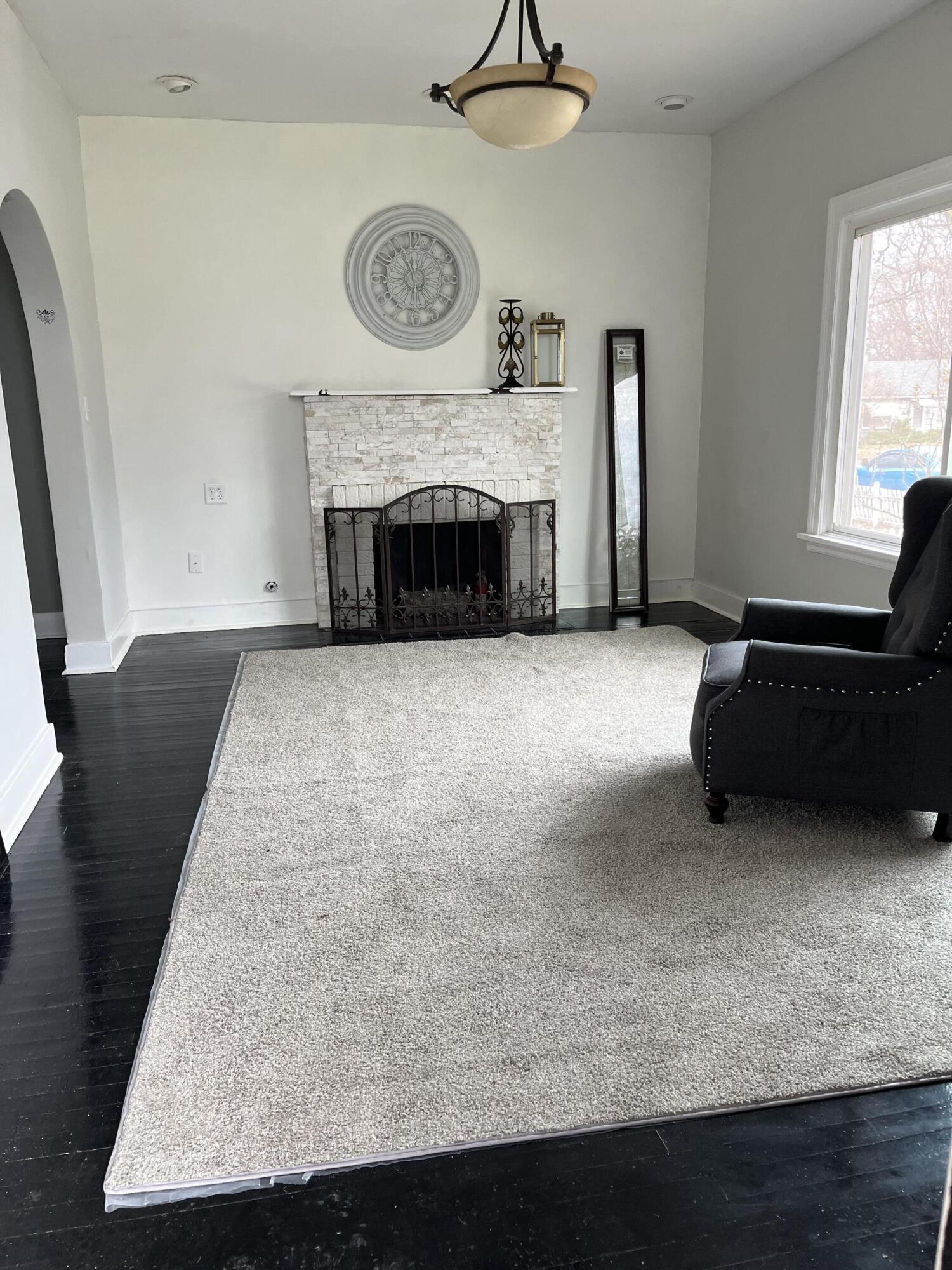 308 South Howard Street Gary, IN 46403 - Photo 8 of 17 a living room with furniture and a fireplace