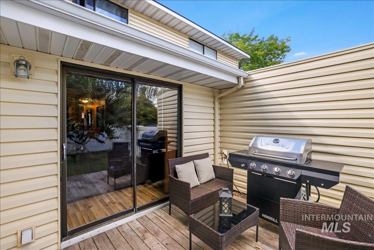 259 Pheasant Road West, Unit 2 Twin Falls, ID 83301 - Photo 26 of 31 Wooden terrace with area for grilling and outdoor lounge area