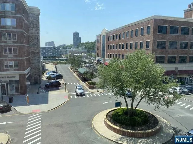 a view of a water fountain in front of a building