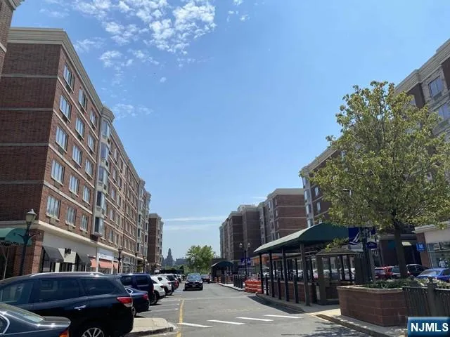 a city street lined with buildings and trees