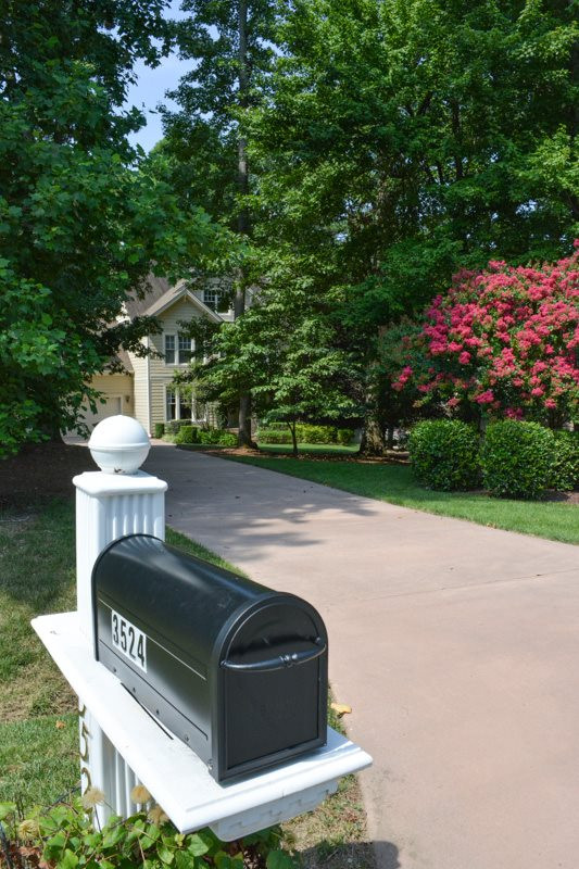 3524 Layton Ridge Drive Apex, NC 27539 - Photo 2 of 25 A beautiful landscaped front yard with a custom stained concrete driveway to match the home. Exterior Front
