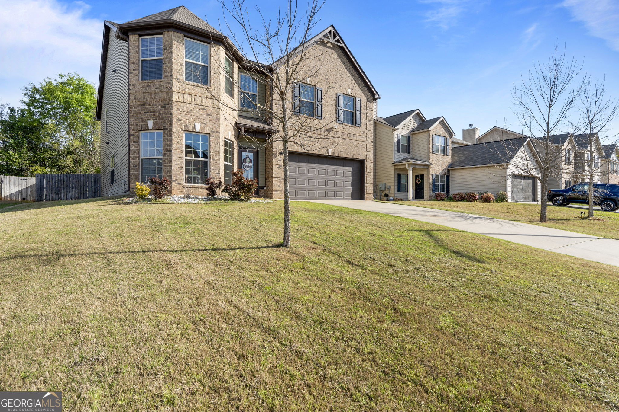 184 Amelia Drive Byron, GA 31008 - Photo 2 of 46 a view of a large white house with a yard