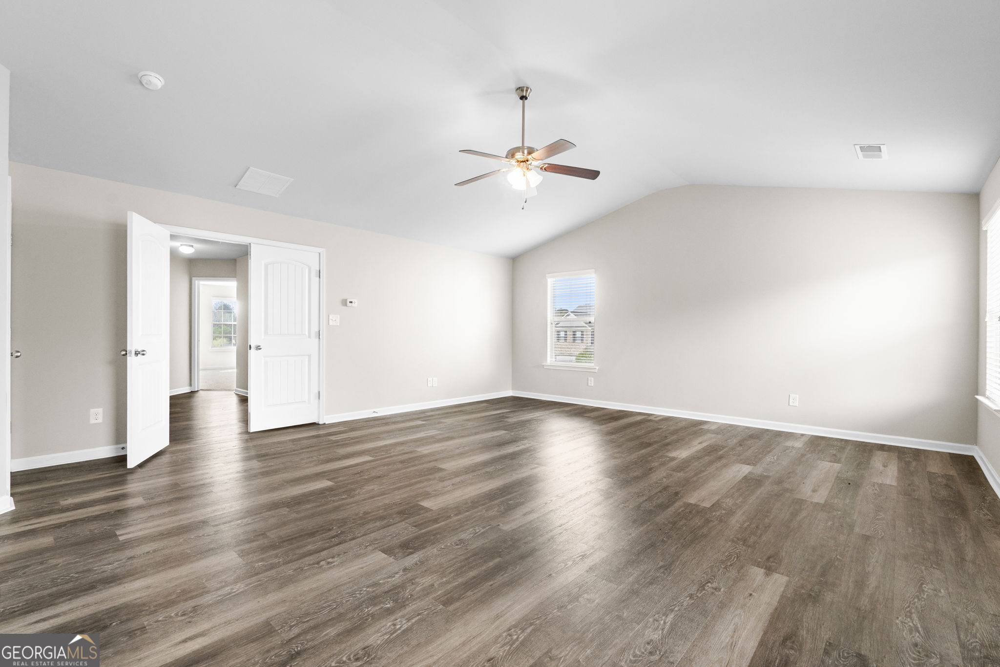 184 Amelia Drive Byron, GA 31008 - Photo 33 of 46 wooden floor in an empty room with a window