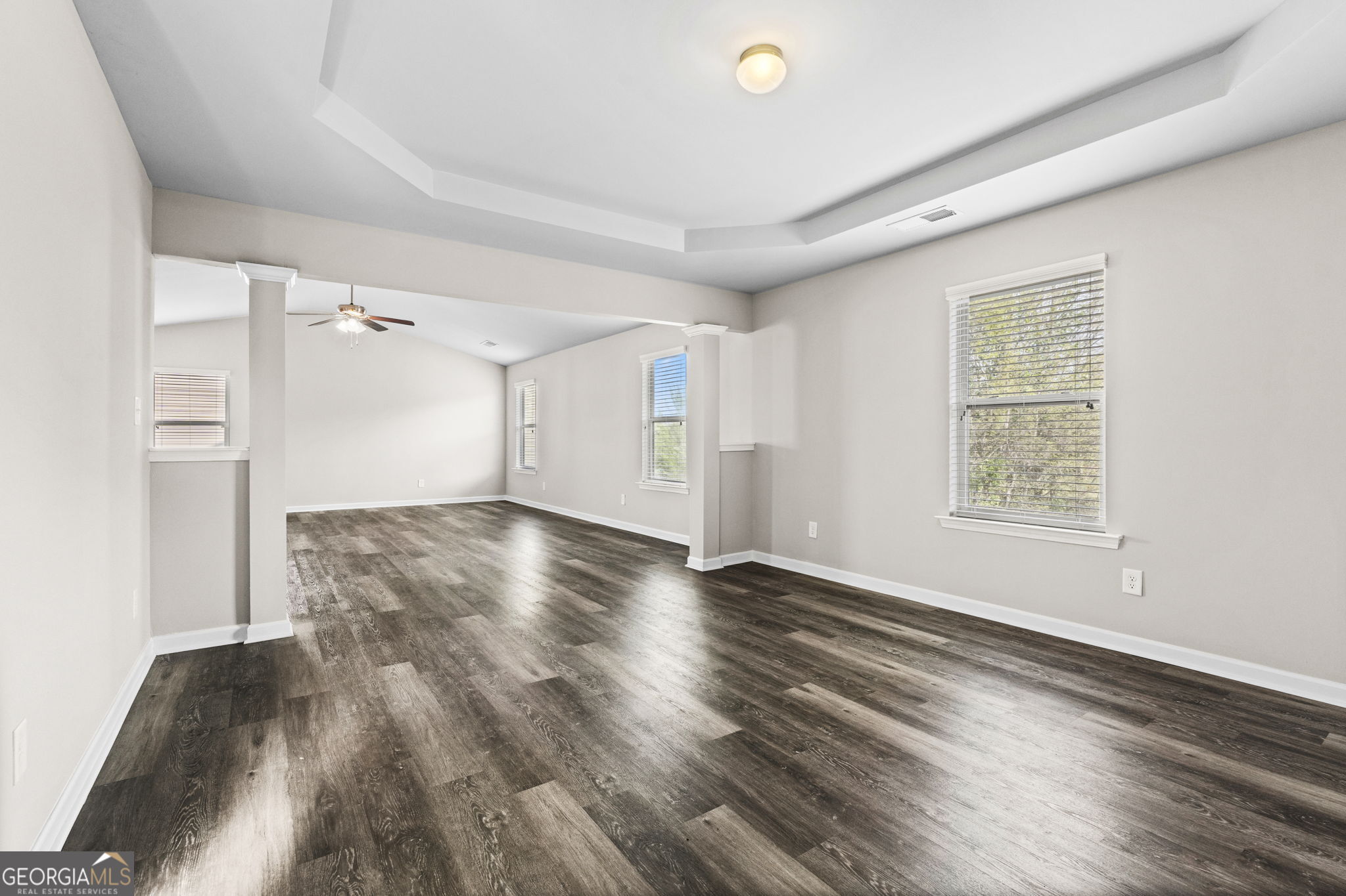 184 Amelia Drive Byron, GA 31008 - Photo 35 of 46 wooden floor in an empty room with a window