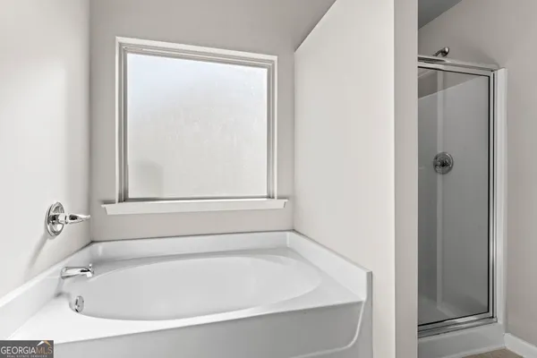 a white bath tub sitting in a bathroom