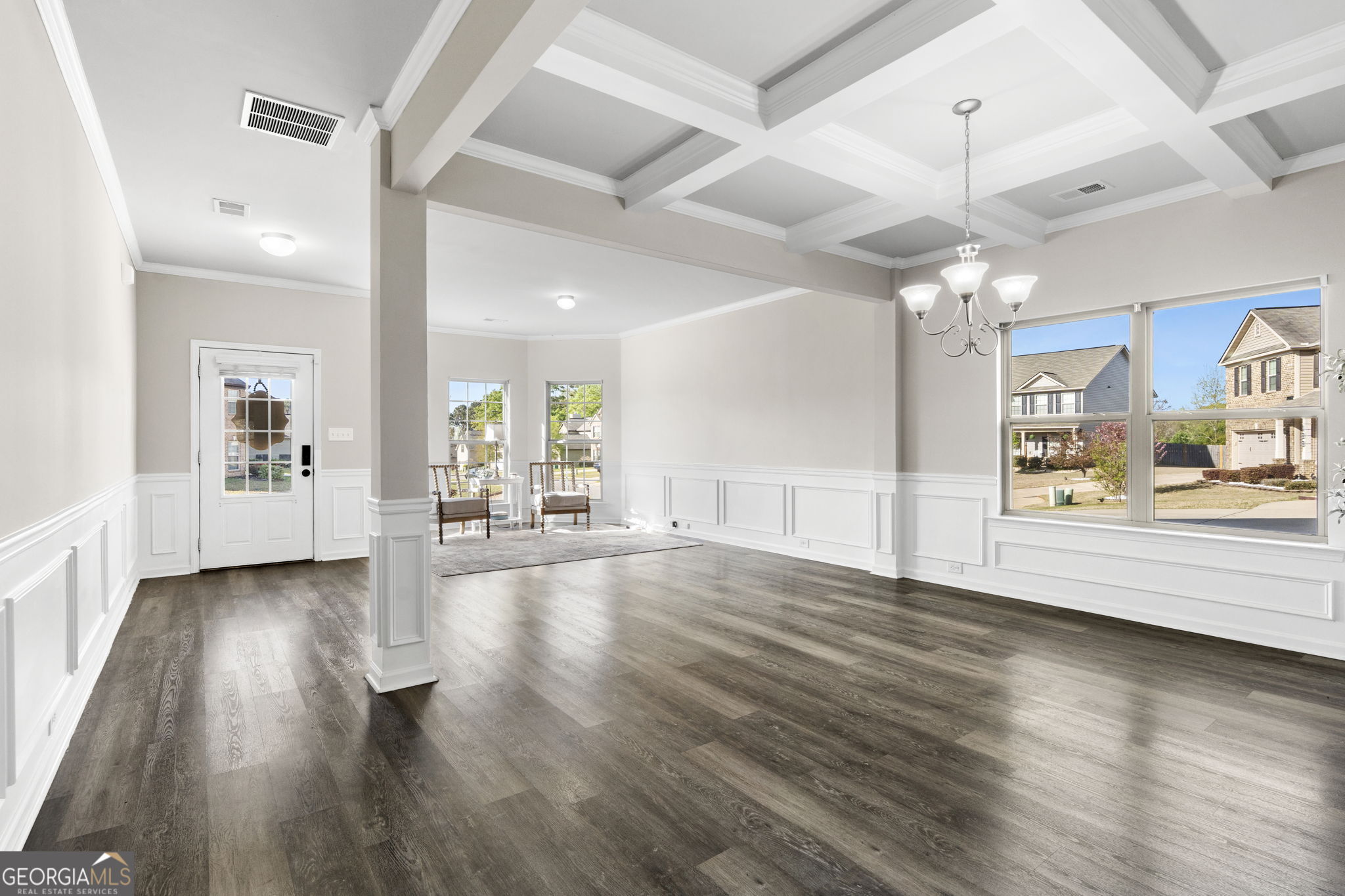 184 Amelia Drive Byron, GA 31008 - Photo 10 of 46 a view of a big room with wooden floor and a kitchen