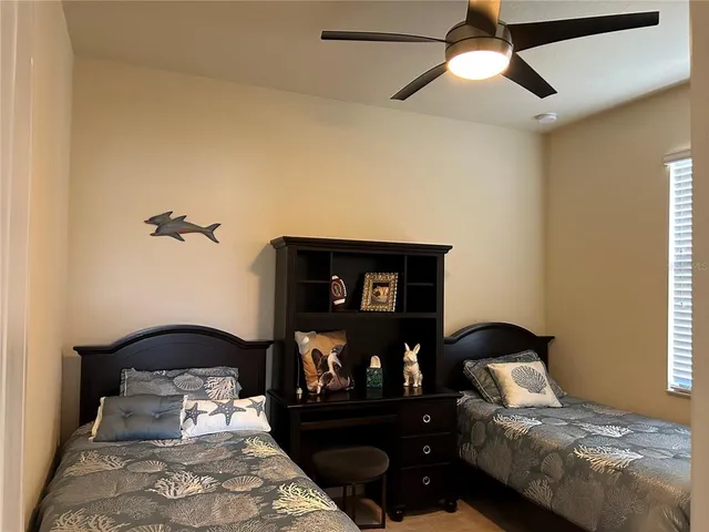 a bedroom with a bed and a mirror on dresser