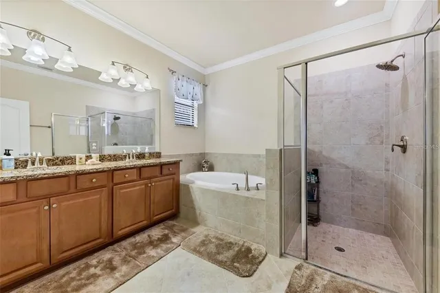 a spacious bathroom with a granite countertop sink mirror and shower