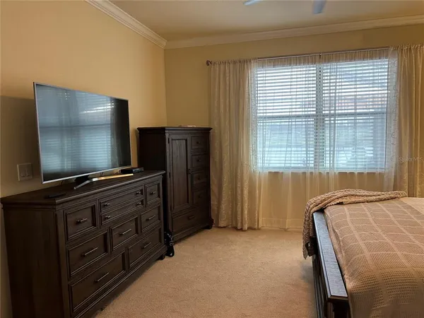 a room with furniture and flat screen tv