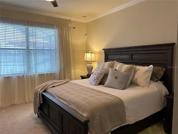 a bedroom with bed and window