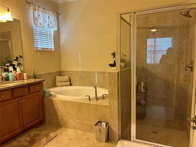 a bathroom with a sink and a shower