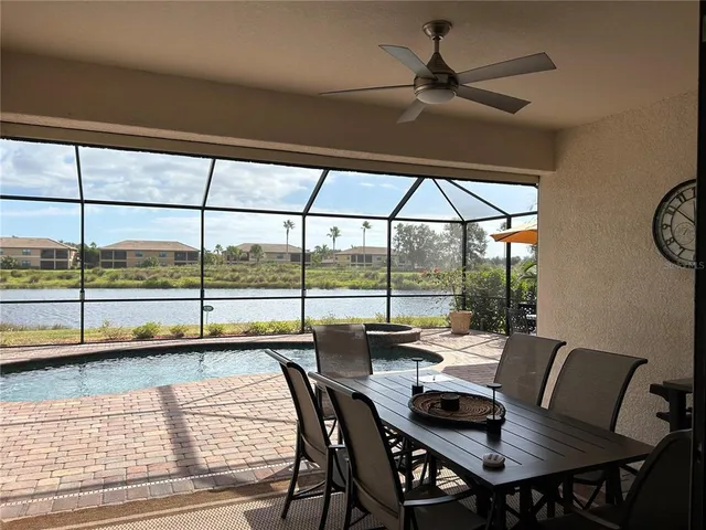 a dining room with furniture and window
