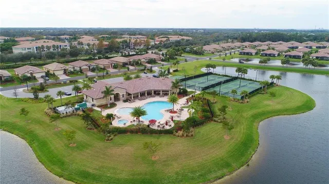 an aerial view of residential houses with outdoor space