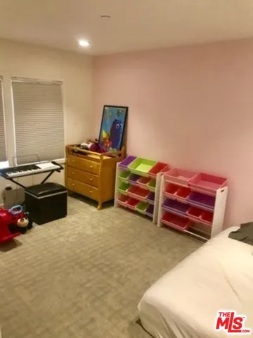 a kitchen with stainless steel appliances a refrigerator and a stove top oven