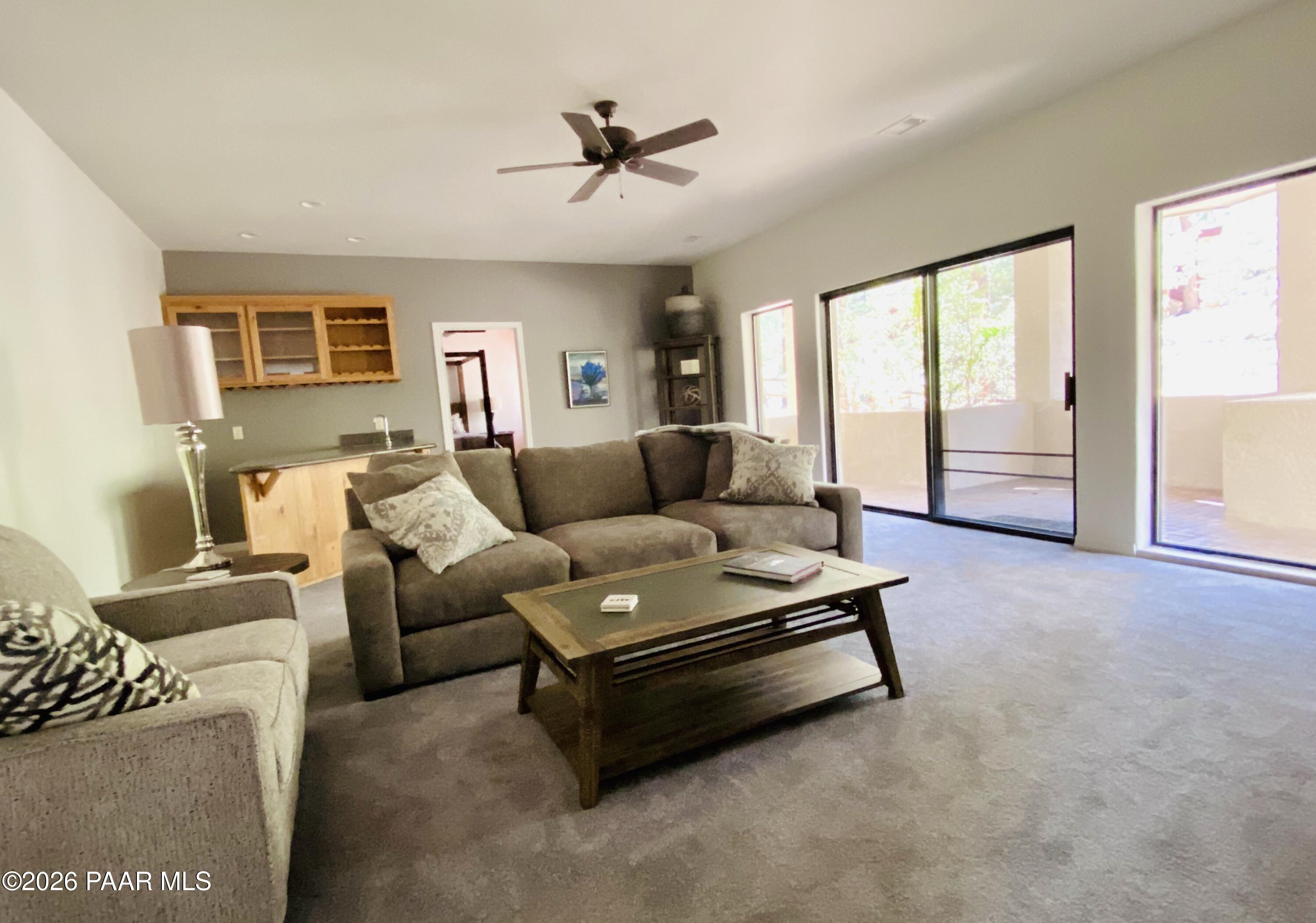 1677 Coyote Road Prescott, AZ 86303 - Photo 14 of 24 a living room with furniture and a large window