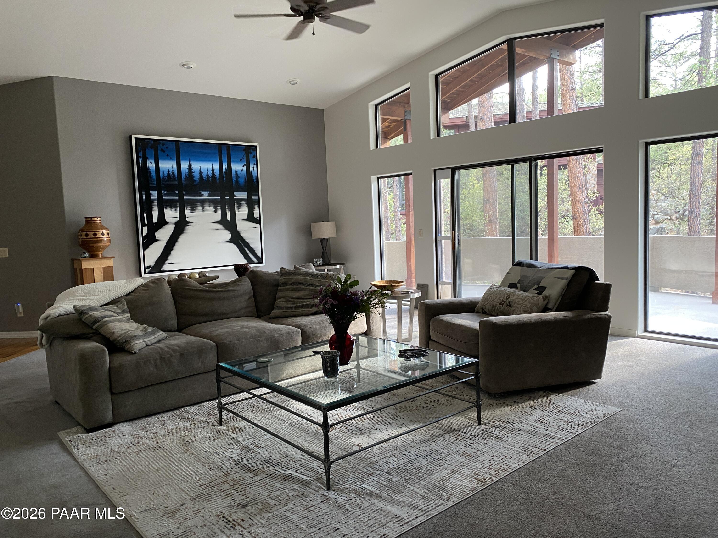 1677 Coyote Road Prescott, AZ 86303 - Photo 3 of 24 a living room with furniture and a large window