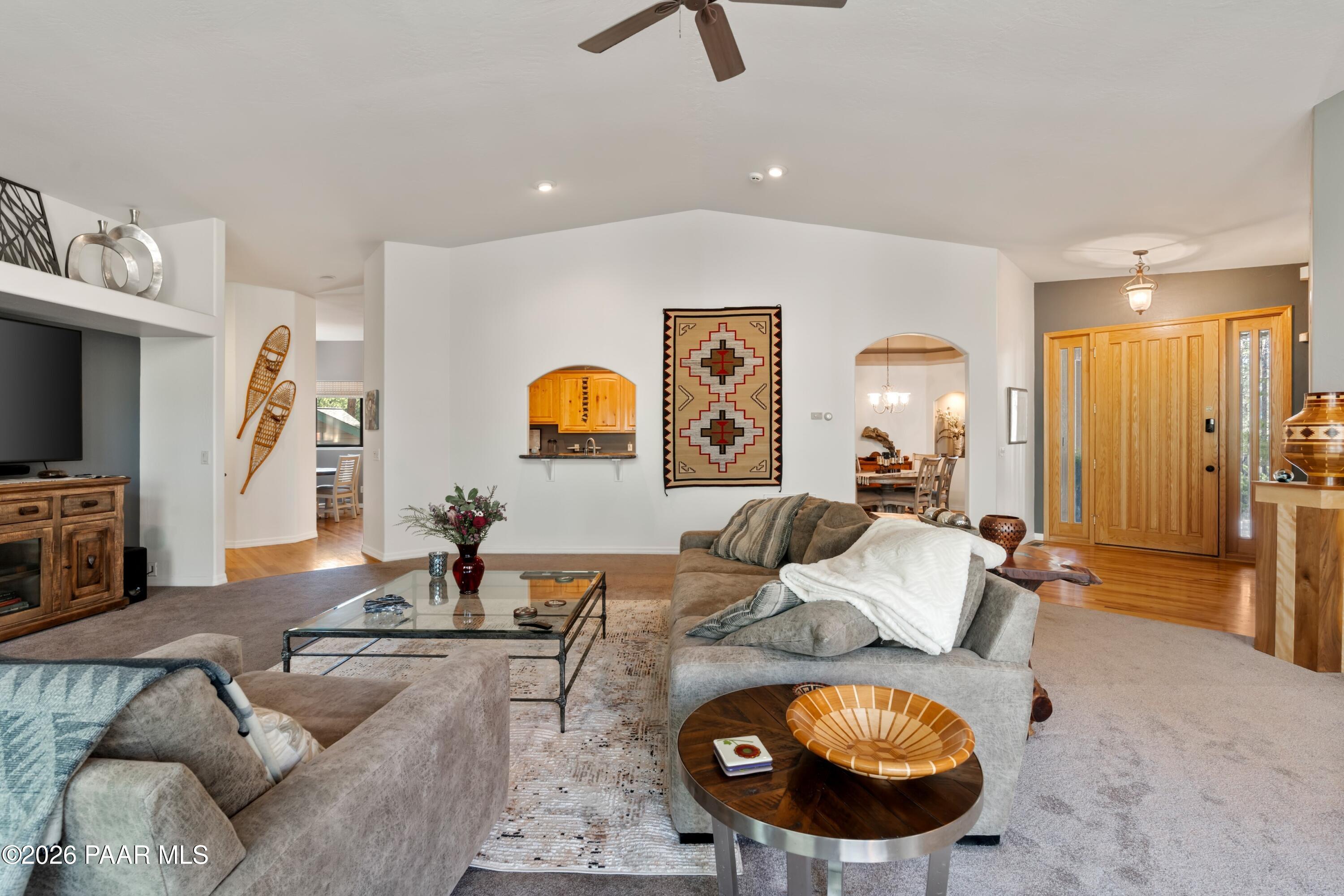 1677 Coyote Road Prescott, AZ 86303 - Photo 5 of 24 a living room with furniture and a flat screen tv