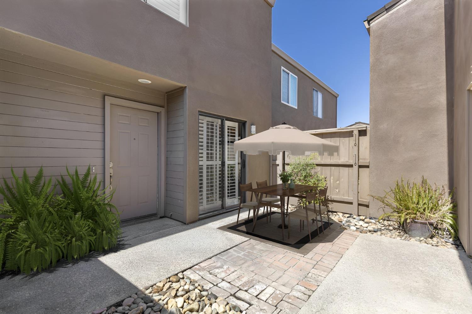 Private courtyard entrance off kitchen/front door. Photo virtually staged