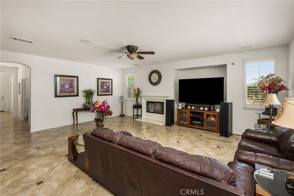 12652 Twin Peak Court Riverside, CA 92503 - Photo 9 of 55 a living room with furniture and a flat screen tv