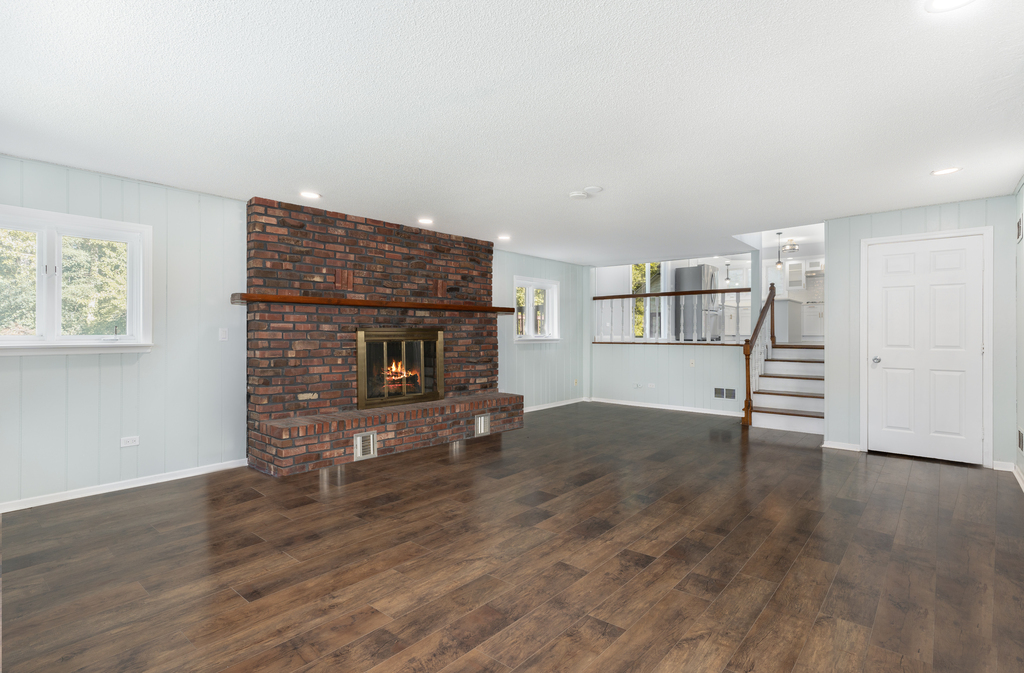 1513 Wood Street Crete, IL 60417 - Photo 15 of 35 a view of empty room with wooden floor and fireplace