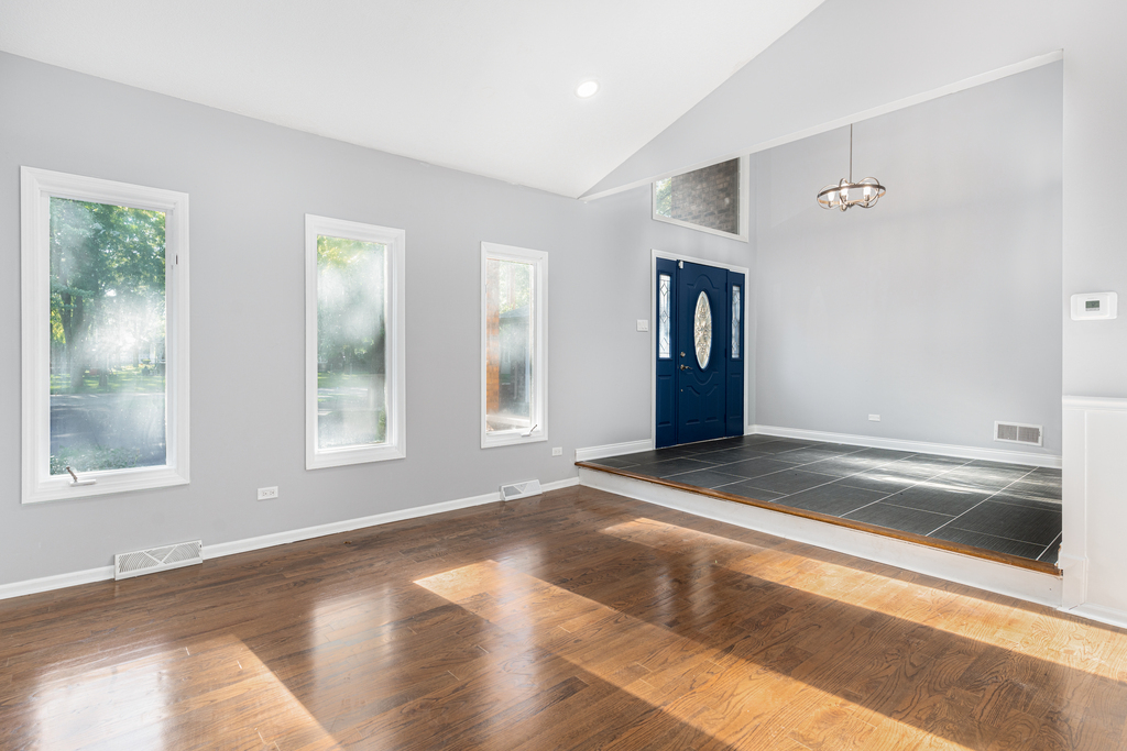 1513 Wood Street Crete, IL 60417 - Photo 2 of 35 a view of an empty room with window and closet area