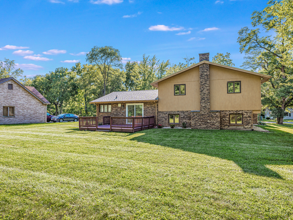 1513 Wood Street Crete, IL 60417 - Photo 24 of 35 a front view of a house with garden