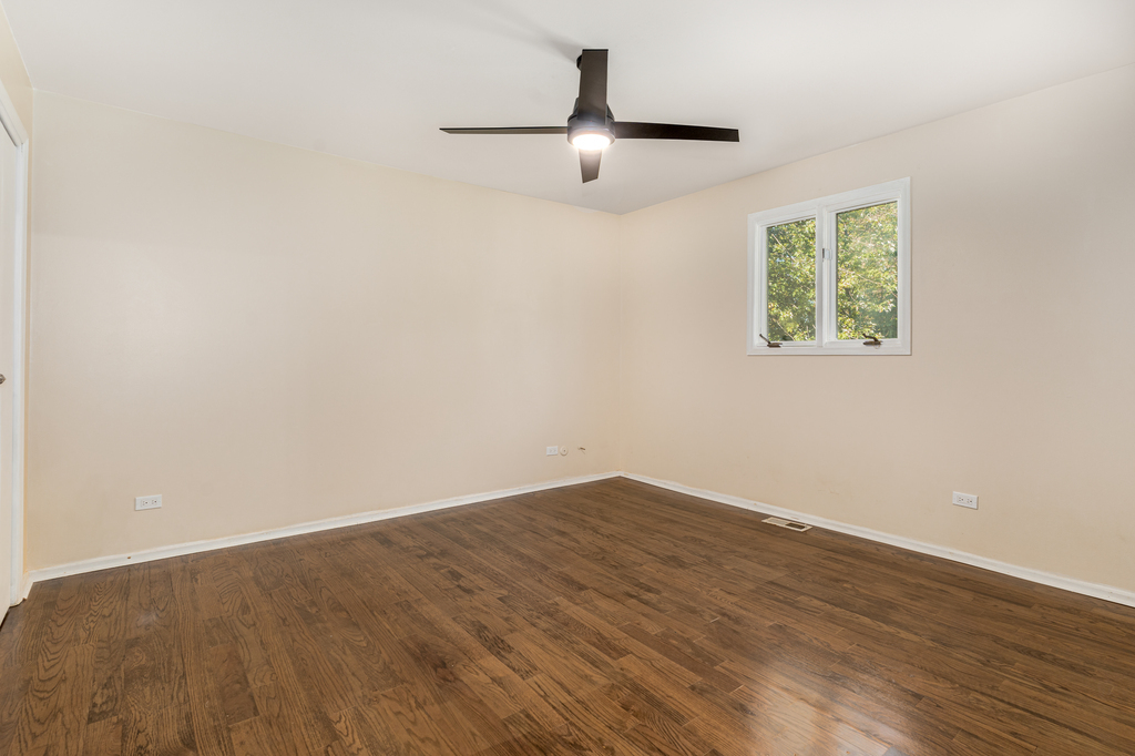 1513 Wood Street Crete, IL 60417 - Photo 10 of 35 a view of empty room with wooden floor