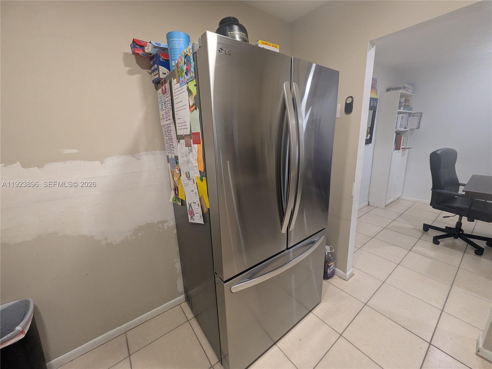 8540 Southwest 149th Avenue, Unit 815 Miami, FL 33193 - Photo 6 of 16 a metallic refrigerator freezer sitting in a kitchen