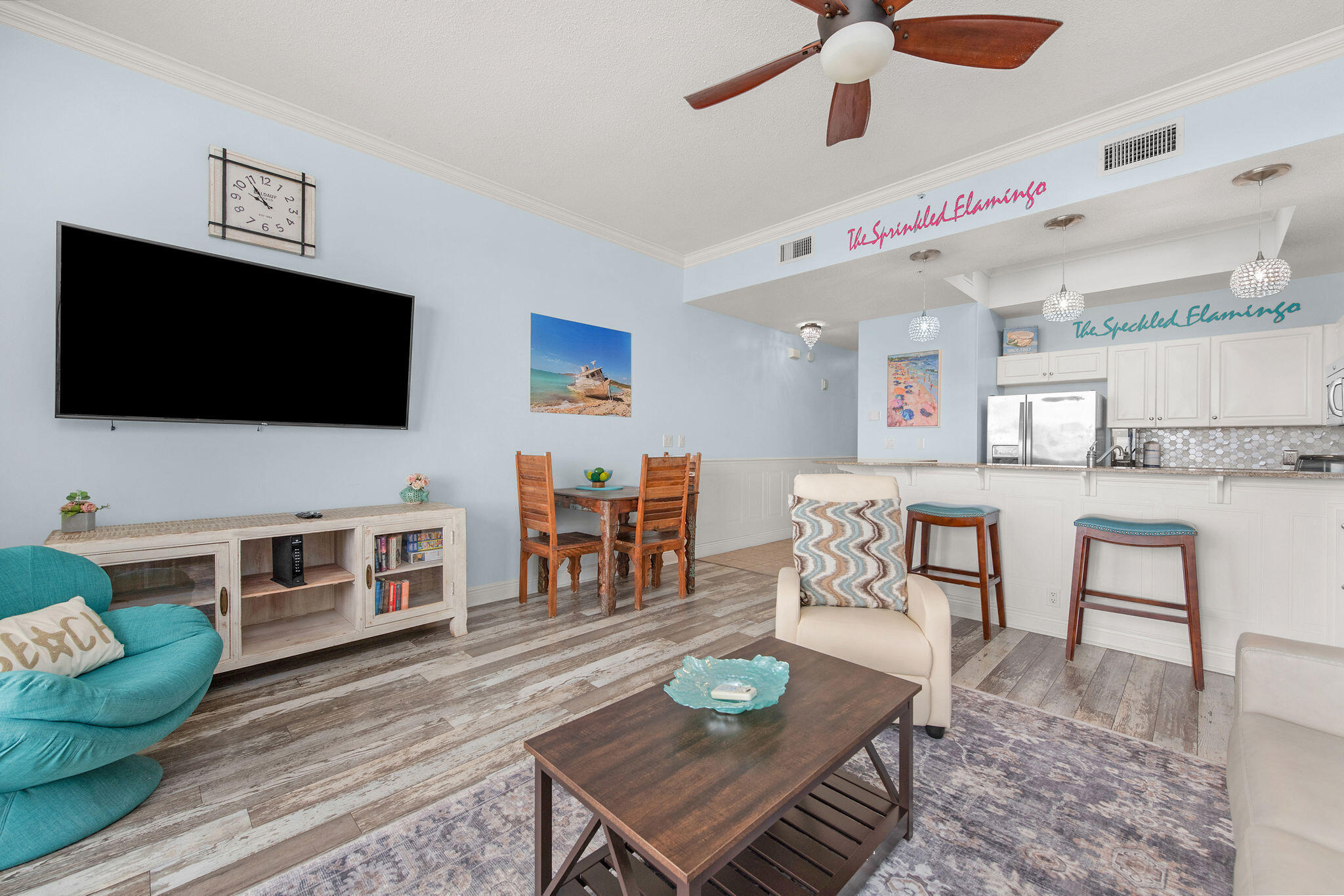 a living room with furniture and a flat screen tv