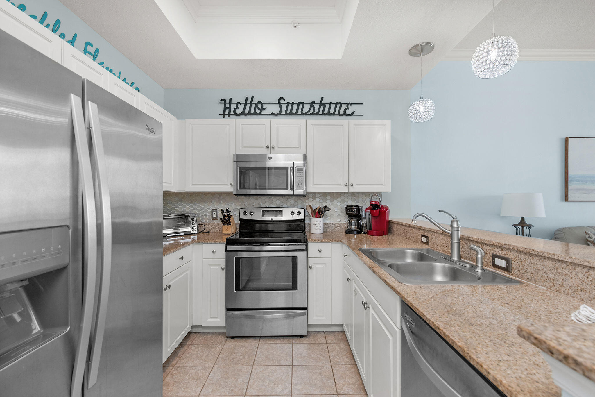 590 Santa Rosa Boulevard, Unit 613 Fort Walton Beach, FL 32548 - Photo 16 of 33 a kitchen with stainless steel appliances granite countertop a sink stove and refrigerator