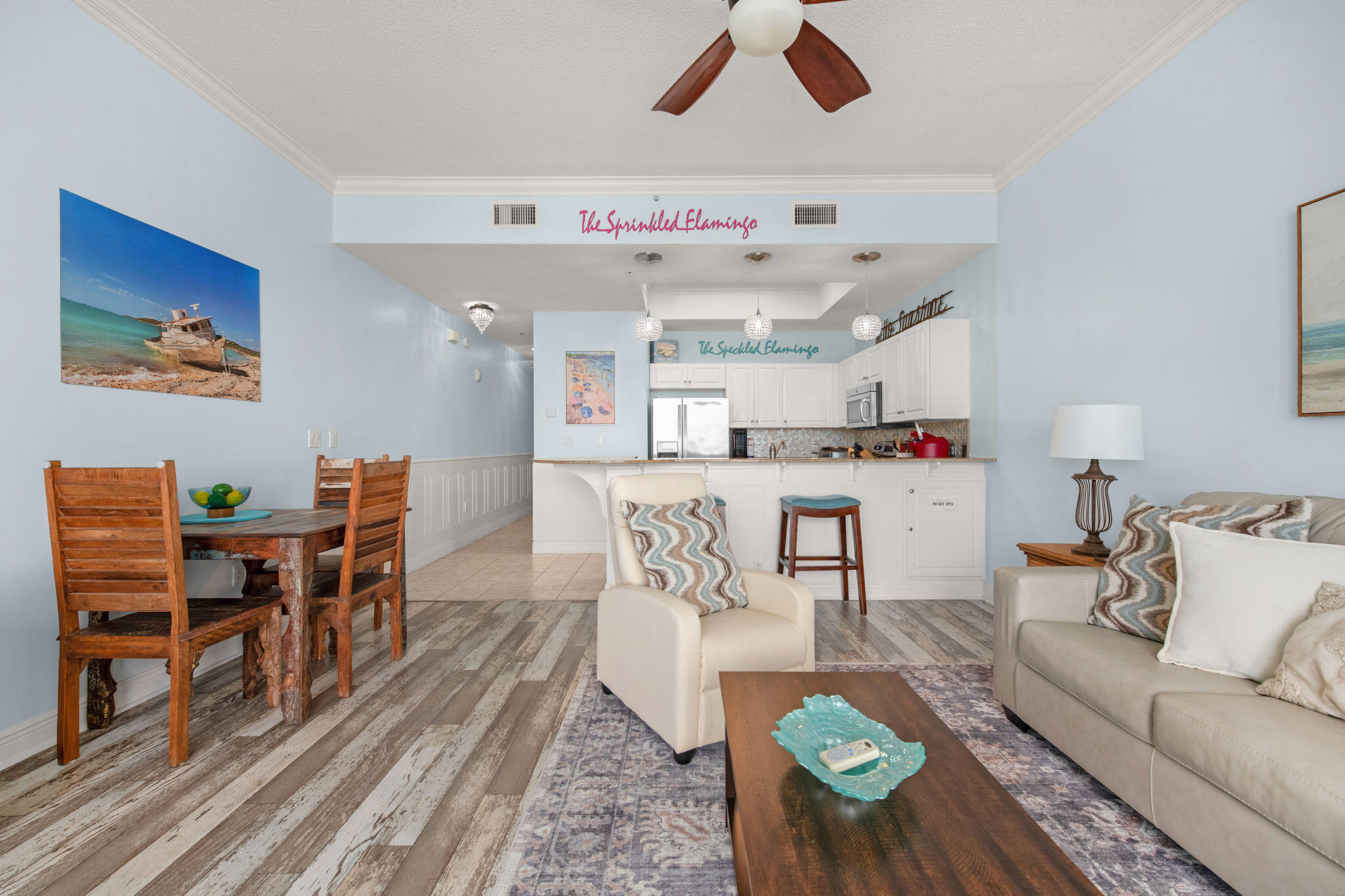 590 Santa Rosa Boulevard, Unit 613 Fort Walton Beach, FL 32548 - Photo 22 of 33 a living room with kitchen island furniture and a dining table