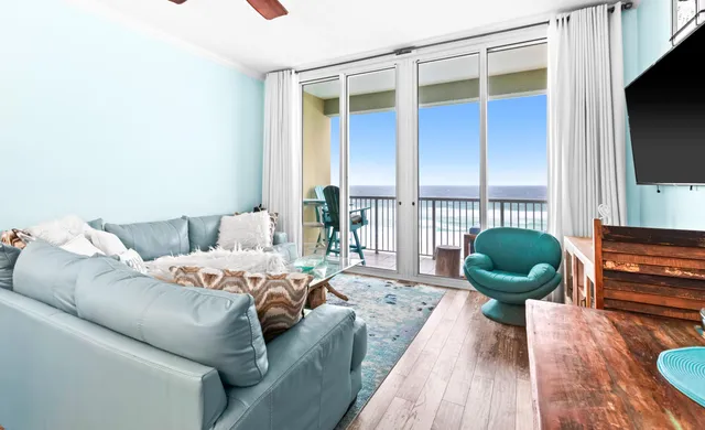 a living room with furniture fireplace and flat screen tv