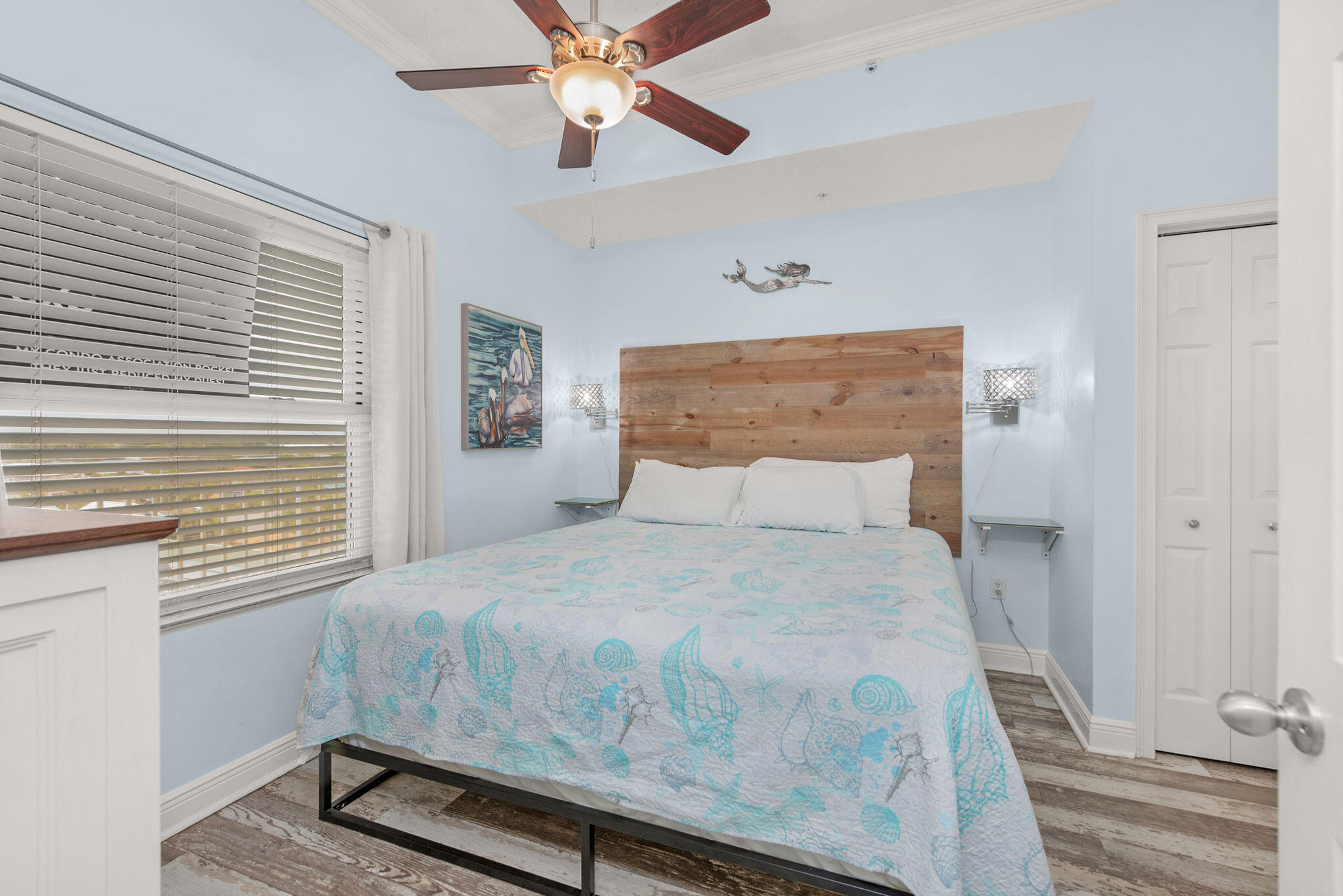 590 Santa Rosa Boulevard, Unit 613 Fort Walton Beach, FL 32548 - Photo 6 of 33 a bedroom with a bed and a chandelier