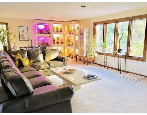 22 Azalea Road Sharon, MA 02067 - Photo 16 of 27 a living room with furniture and floor to ceiling windows