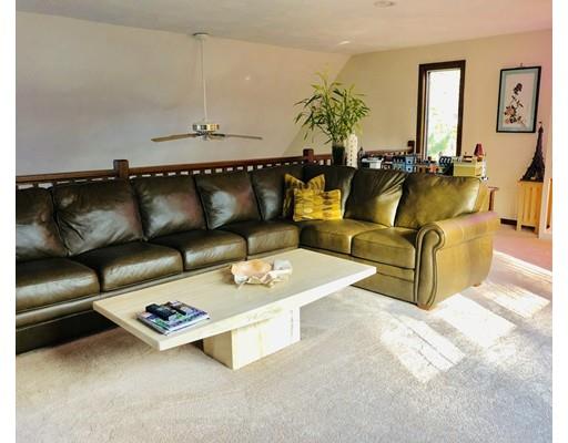 22 Azalea Road Sharon, MA 02067 - Photo 17 of 27 a living room with furniture and a chandelier