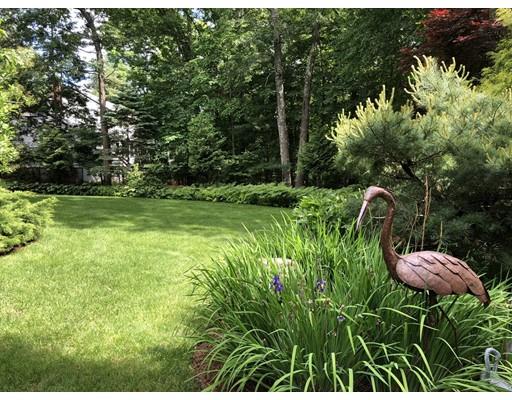 22 Azalea Road Sharon, MA 02067 - Photo 21 of 27 a backyard of a house with table and chairs
