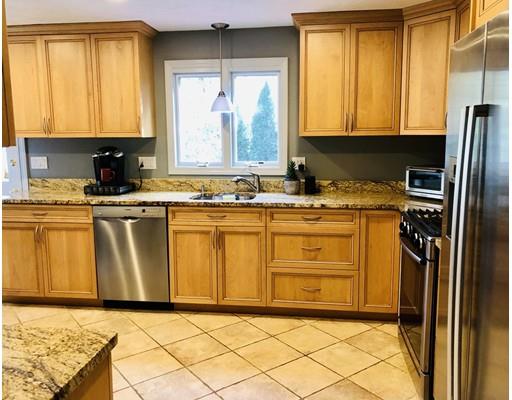 22 Azalea Road Sharon, MA 02067 - Photo 7 of 27 a kitchen with stainless steel appliances granite countertop a sink window and cabinets