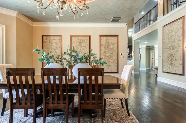 a kitchen with granite countertop white cabinets and sink