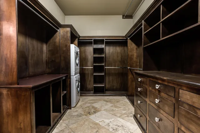a kitchen with a refrigerator and a table