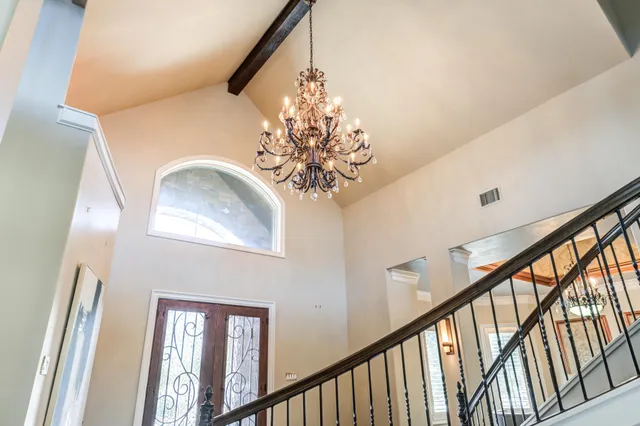a kitchen with kitchen island granite countertop a sink stove and refrigerator