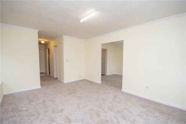 a kitchen with stainless steel appliances granite countertop a stove a sink and a refrigerator with wooden floor