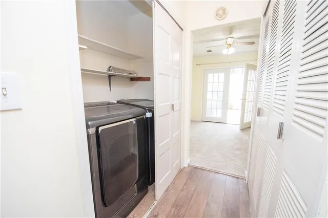 a spacious bathroom with a granite countertop sink mirror and shower